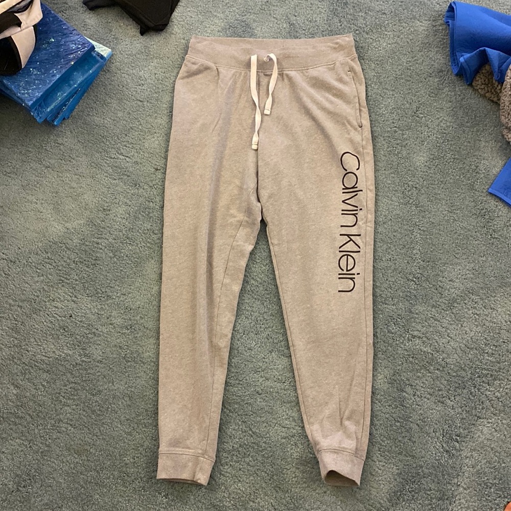 Gray sweat pants.